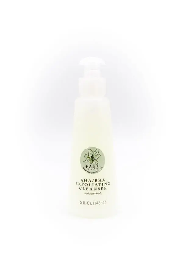 A bottle of facial cleanser with green label.