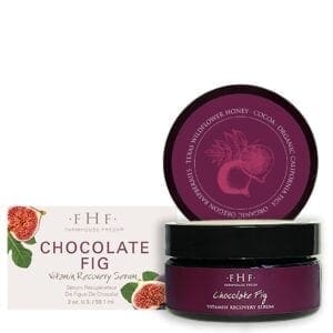 A jar of chocolate fig body butter sitting next to a package.