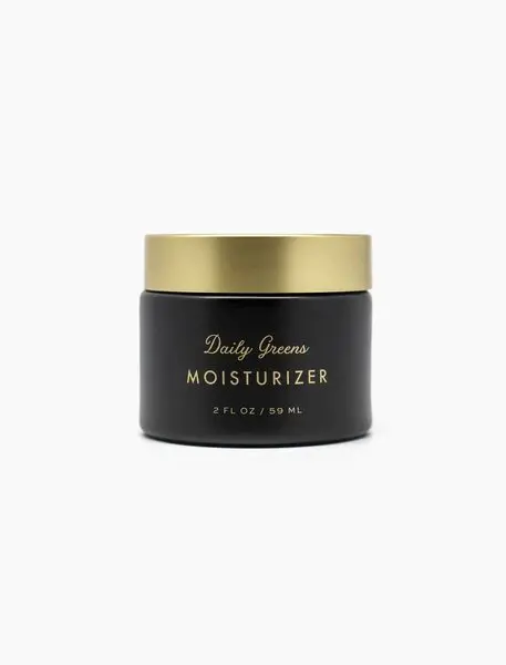 A black and gold container of moisturizer.