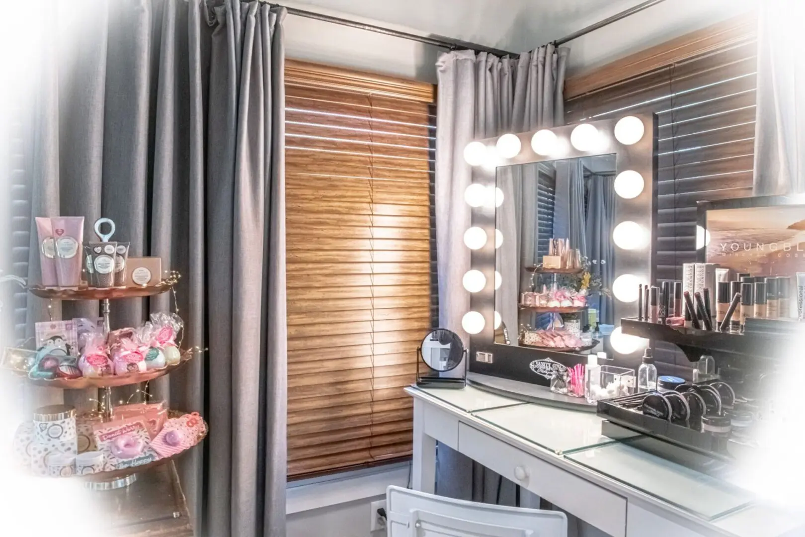 A vanity with lights and a mirror in it
