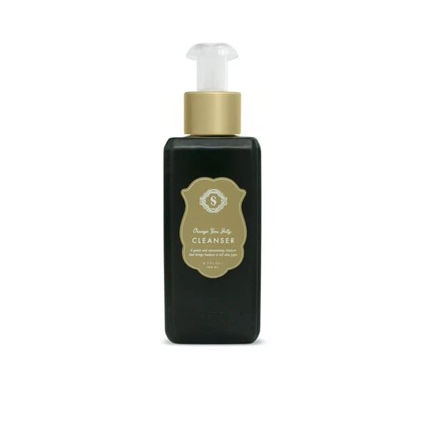 A bottle of face oil with a white cap.