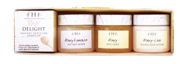 A box of two jars with honey on them.