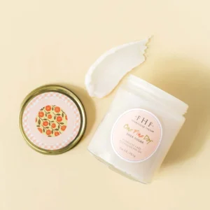 A close up of a jar and some cream