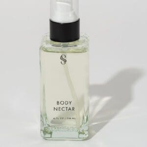 Body Nectar Perfume Bottle on the Table