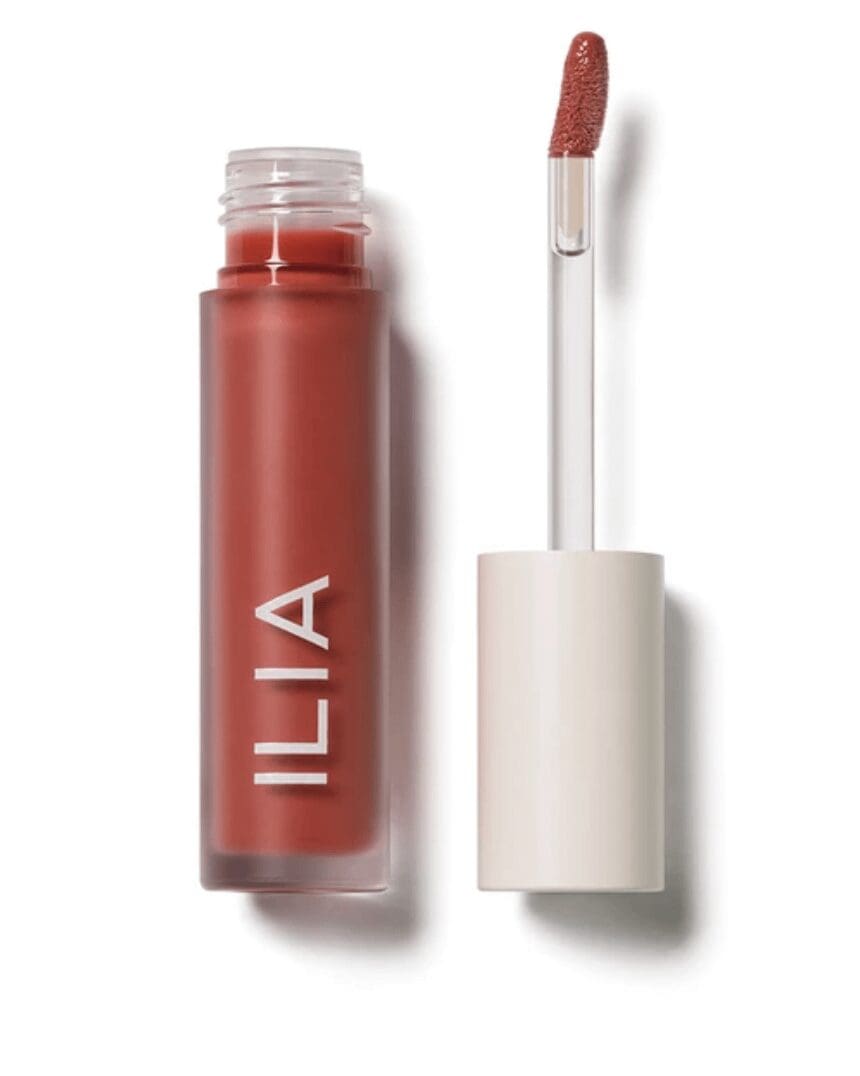 Balmy gloss tinted lip oil saint with white background