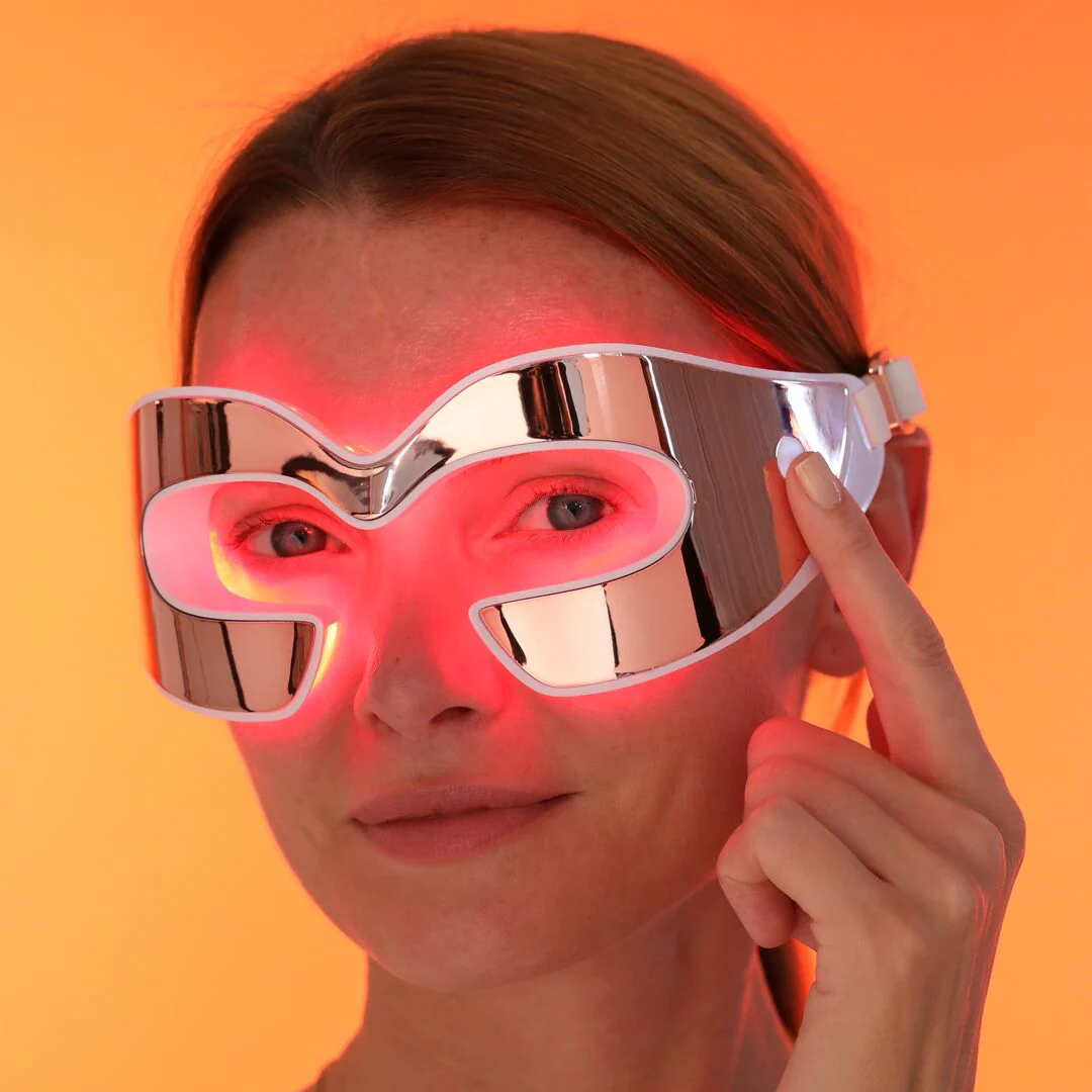 A woman wearing a pair of glasses with red light