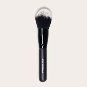 Black makeup brush with white bristles.
