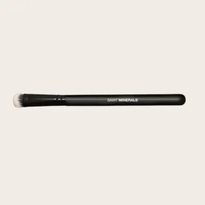 Makeup brush with black handle.