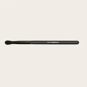 Black makeup brush with "Saint Minerals" text.