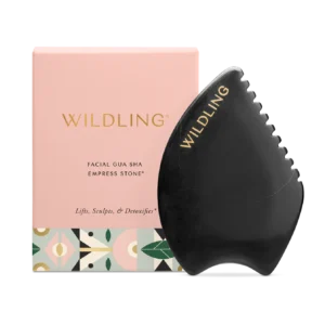 Facial gua sha stone with packaging.